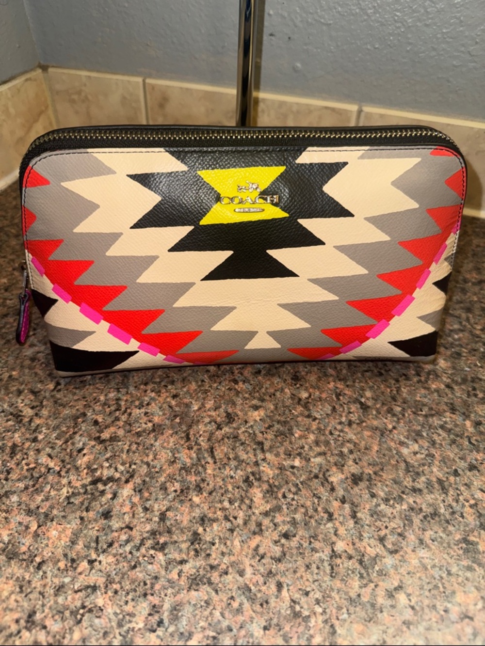 COACH RARE HARD TO FIND CLUTCH IN AZTEC PRINT (like new)